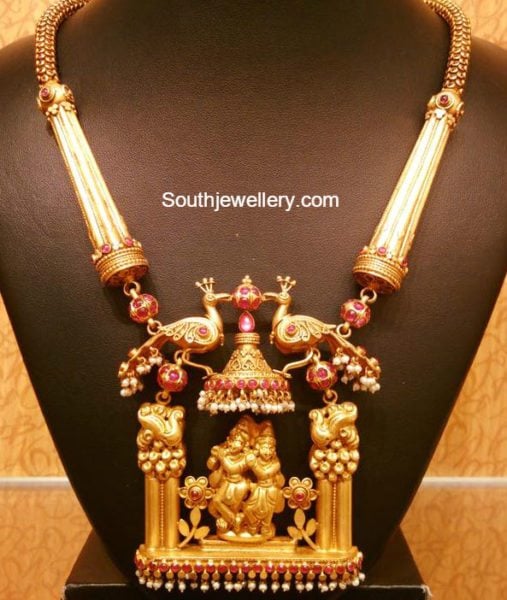 antique gold necklace with peacock krishna pendant