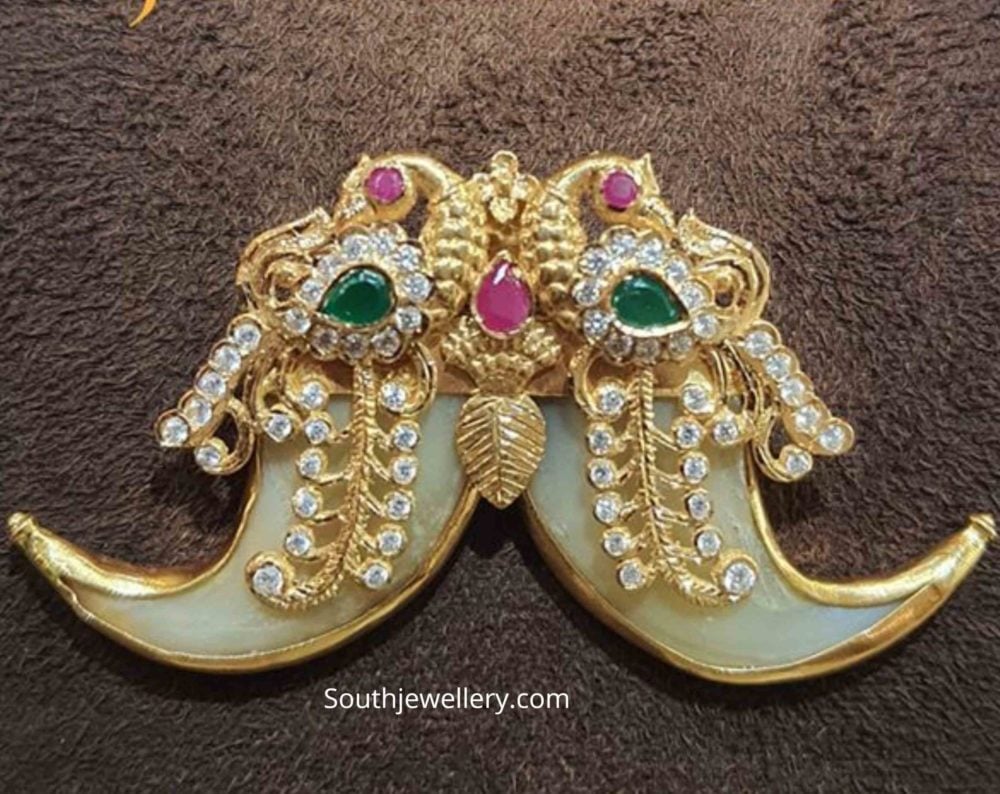Peacock puligoru pendant Indian Jewellery Designs