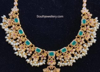 peacock gold necklace with emeralds