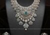 diamond and emerald necklace and jhumkas