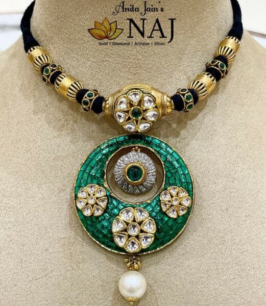 black thread necklace with emerald pendant