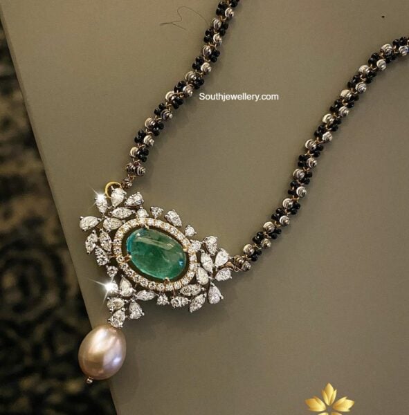 Black beads necklace with diamond emerald pendant